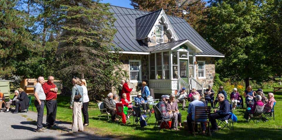 Group of people sitting on a lawn