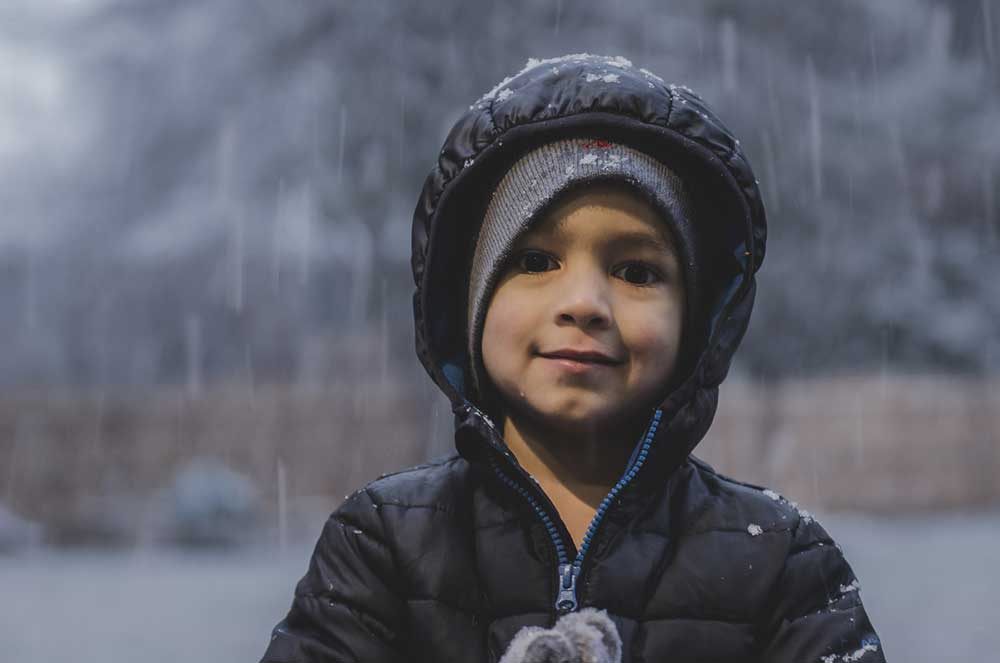 Young boy outside smiling